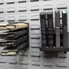 magazine holders on a gun wall