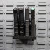 vertical magazine holder on a gun wall