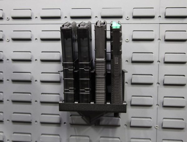 vertical magazine holder on a gun wall