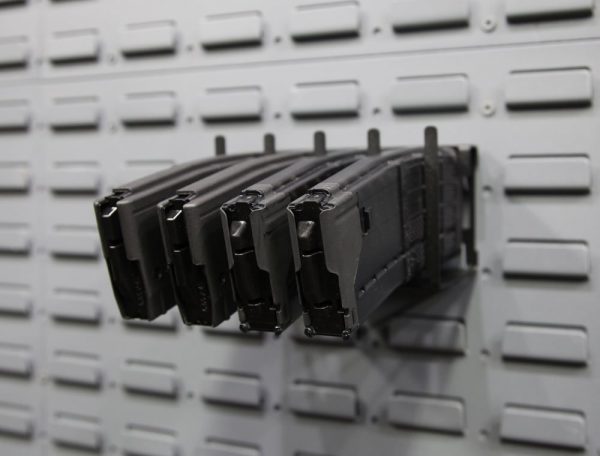 horizontal magazine holder on a gun wall