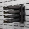horizontal magazine holder on a gun wall
