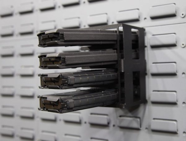 horizontal magazine holder on a gun wall